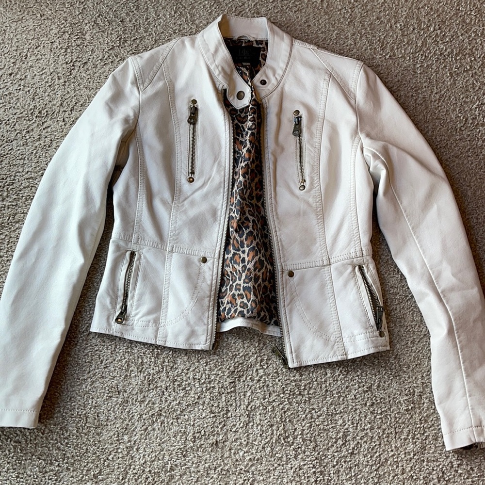 Small, White leather jacket.